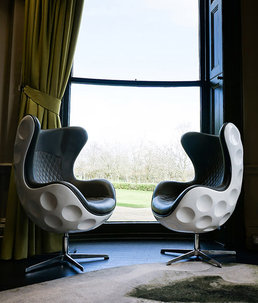 https://www.dimpledesigned.com/cdn/shop/products/Dimple-Golf-Chair-in-the-home-window_grande.jpg?v=1680017987